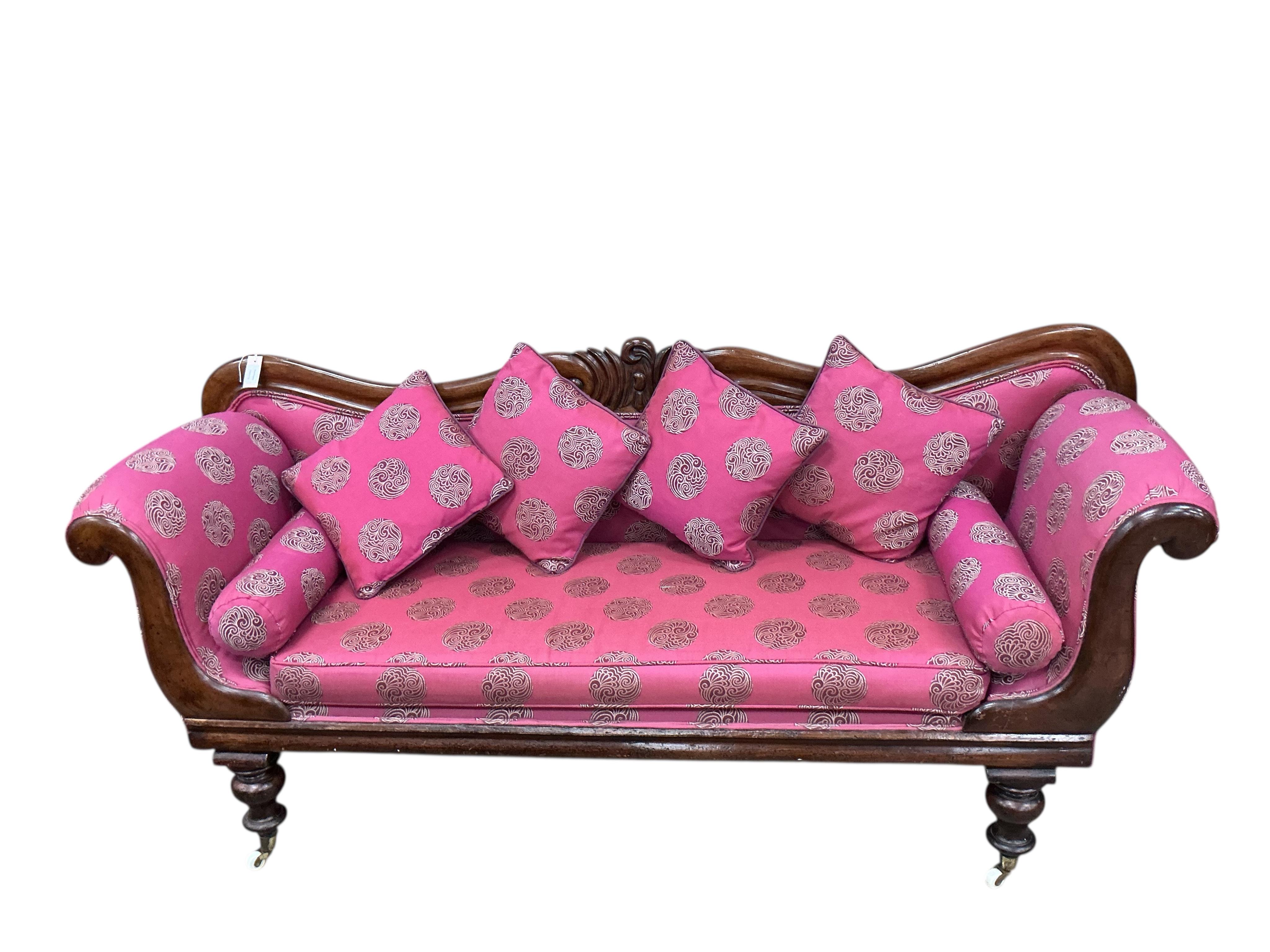 A Victorian mahogany scroll arm settee, width 200cm, depth 55cm, height 86cm